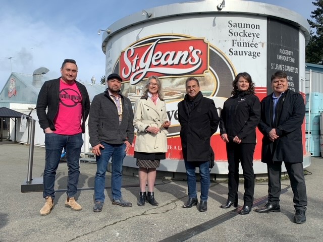 Representative of First Nations with Minister Murray in front of the St. Jean's Cannery visitor centre.